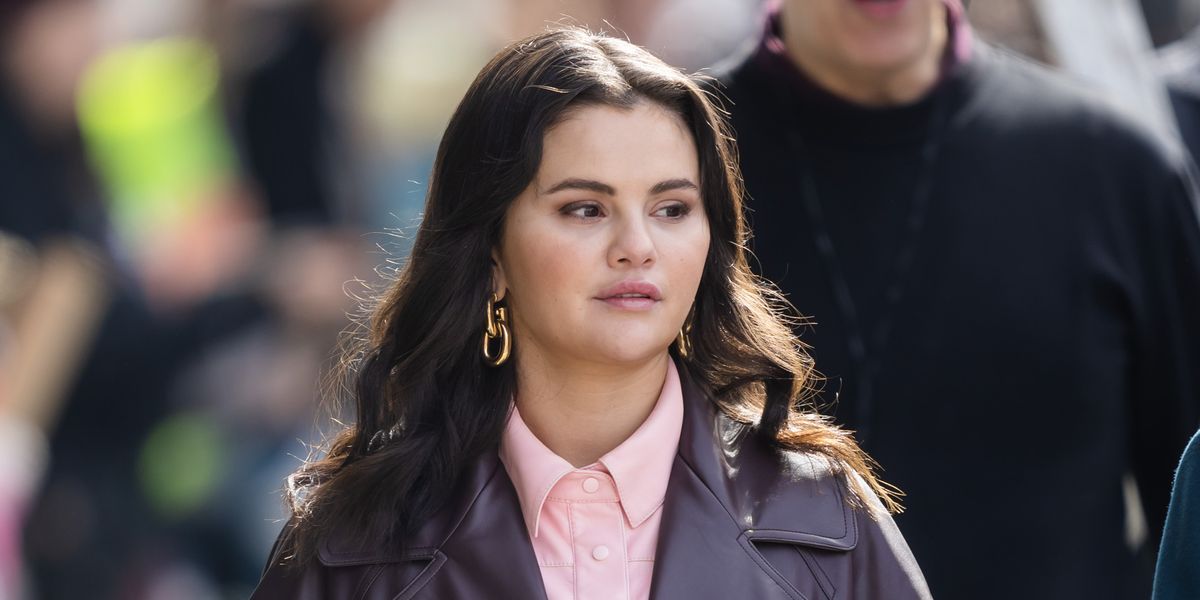 Selena Gomez Wears Strapless Orange Corset and Stylish Leather-based Jacket