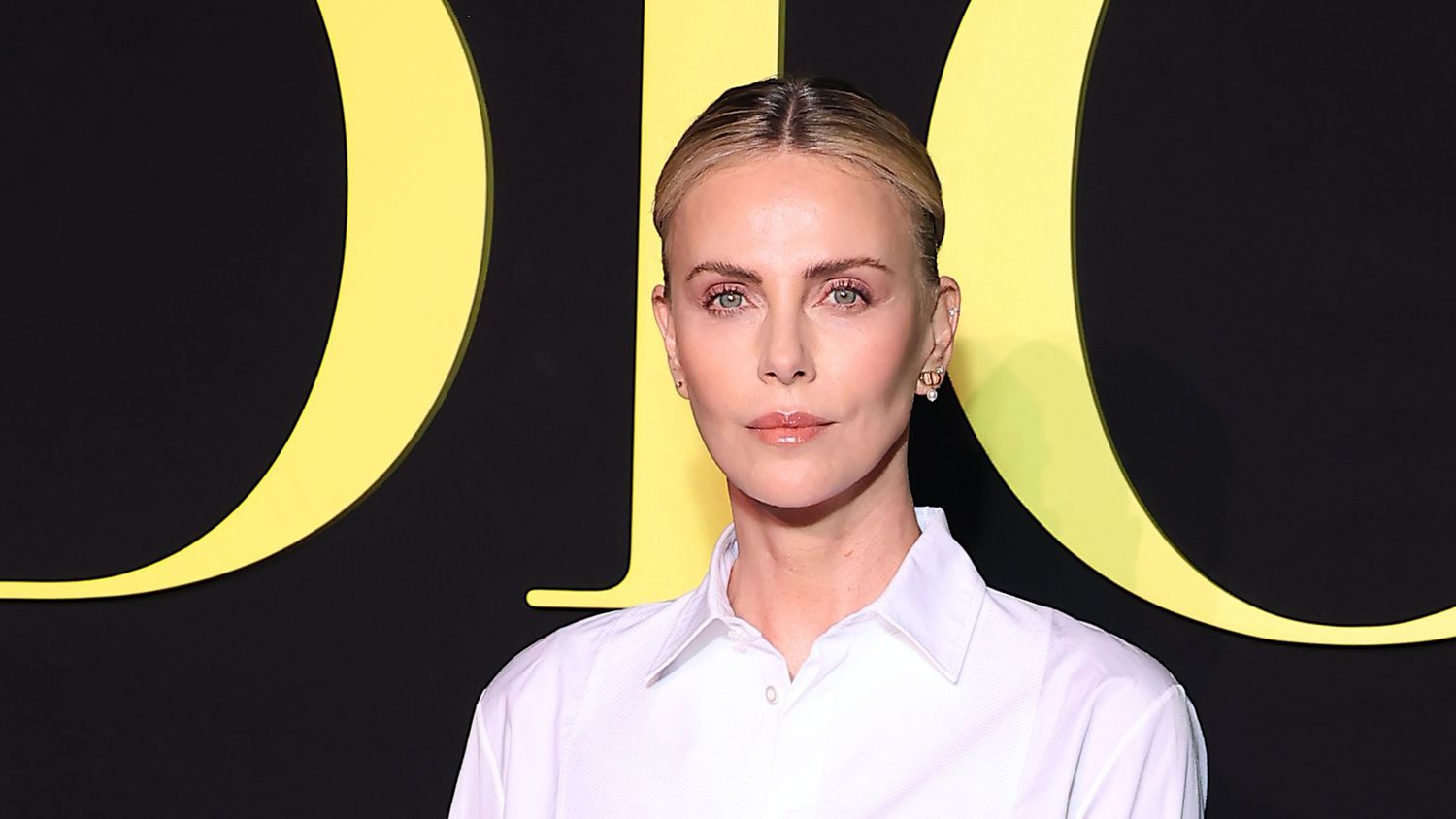 Charlize Theron Paired a Completely See-By Beaded Maxiskirt With Black Underwear and a Button-Down