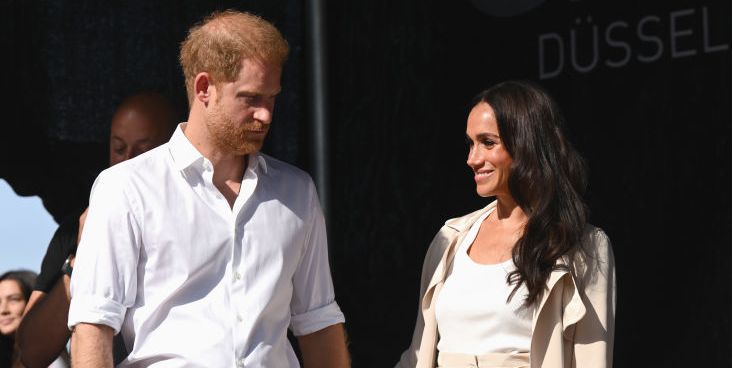 Meghan Markle Wears Cream Silk Trench Over Matching Excessive-Waisted Slacks