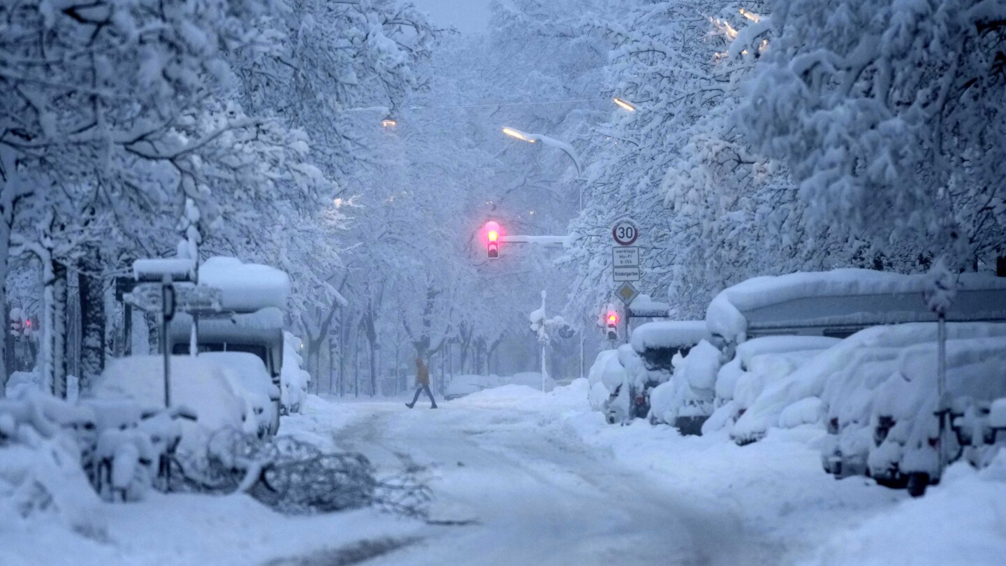 A snowstorm brings Munich airport to a standstill and causes journey chaos in Germany