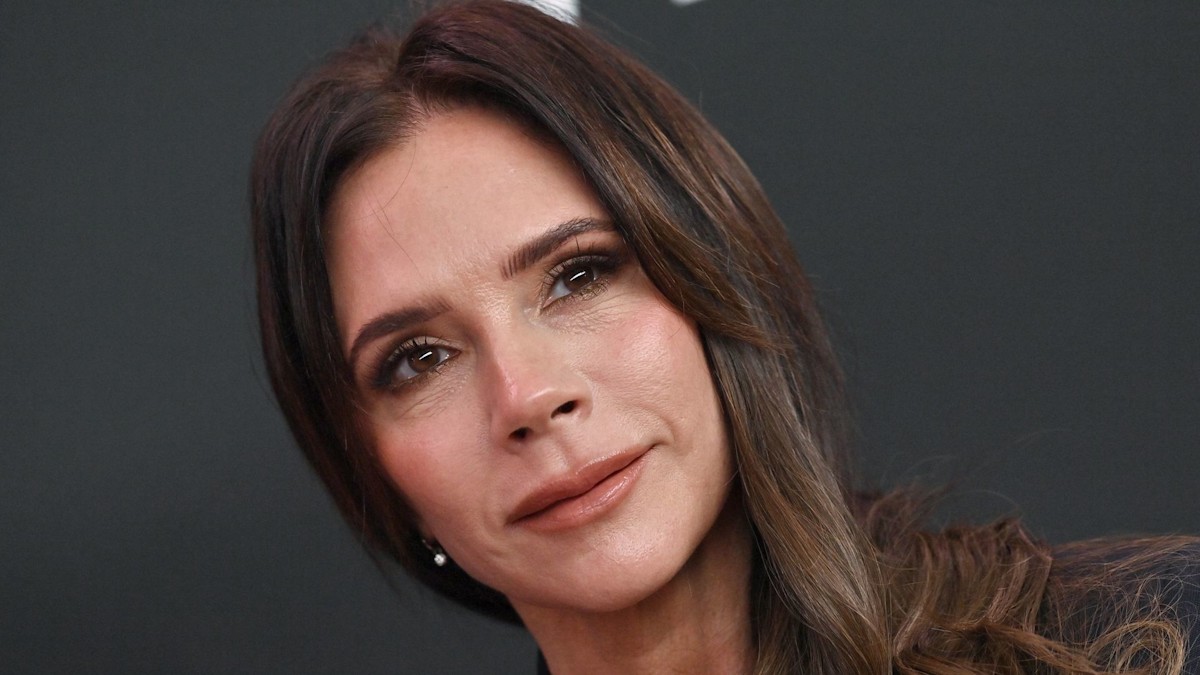 Victoria Beckham poses in satin underwear and completely sheer robe
