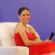 See Meghan Markle’s Crimson Ruffled Costume in Nigeria See Meghan Markle’s Crimson Ruffled Costume in Nigeria