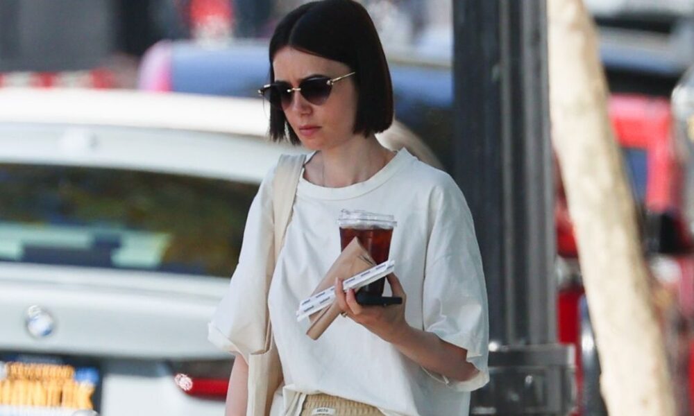 Emily Cooper Would By no means Put on Lily Collins’ Trouser-and-Coach Combo