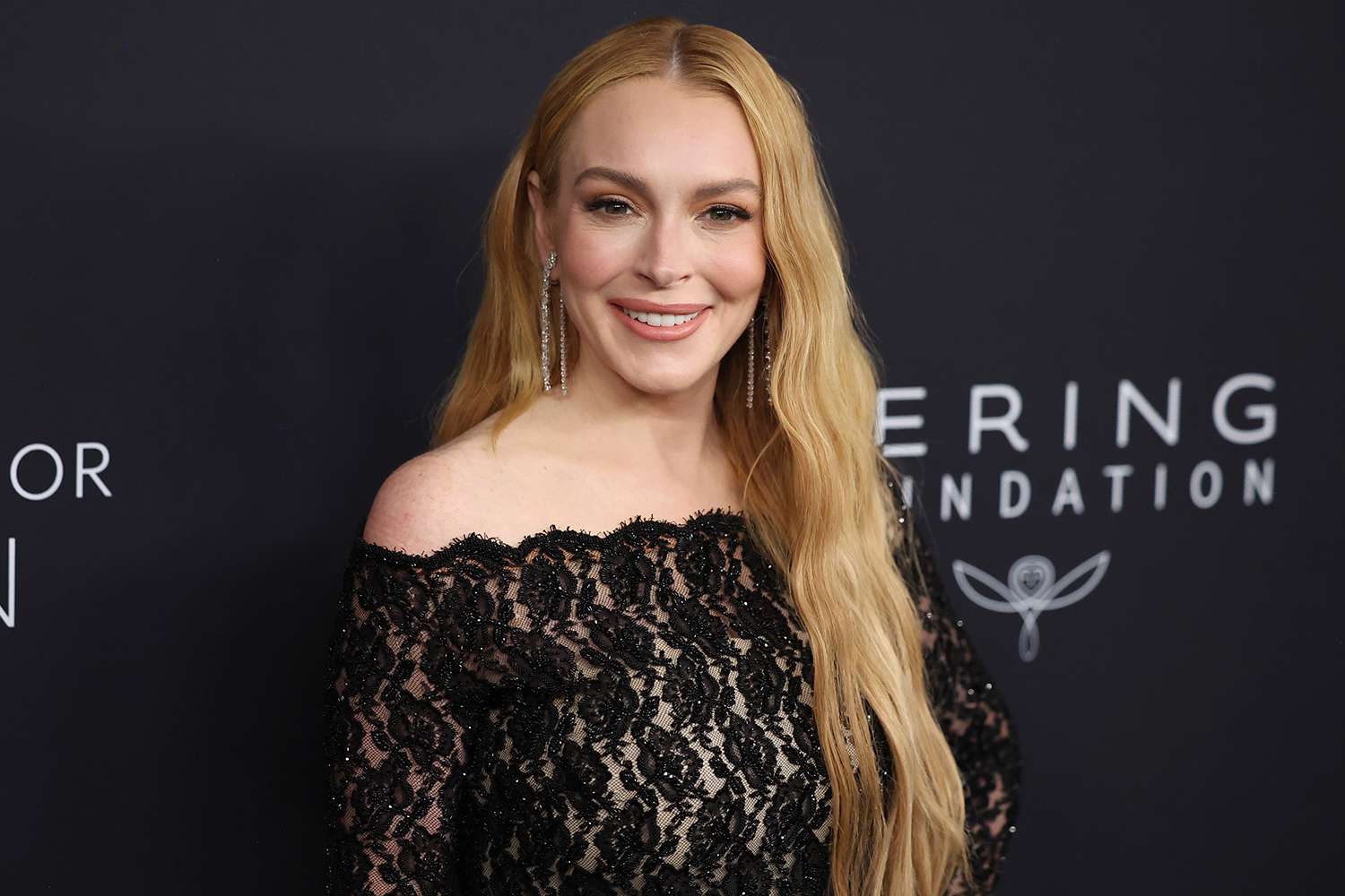 Lindsay Lohan Dons Sheer Lace Bodysuit at Kering Basis Occasion