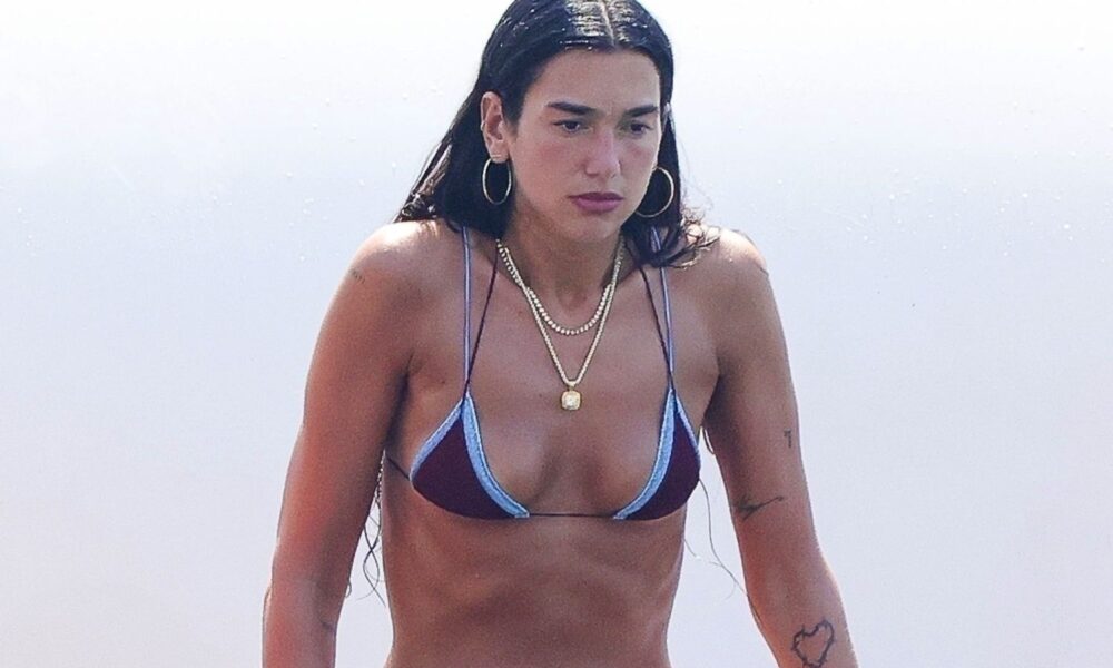 Dua Lipa Places a Twist on the Tiny Bikini Whereas Doing Yoga Atop a Paddleboard in Ibiza
