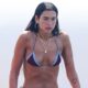 Dua Lipa Places a Twist on the Tiny Bikini Whereas Doing Yoga Atop a Paddleboard in Ibiza